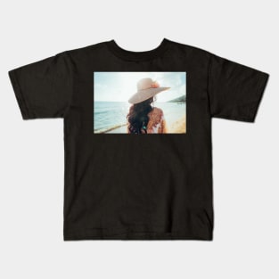 Elegant Woman With Straw Hat Walking Alone on Beach Kids T-Shirt